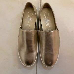 Calvin Klein Gold slip on sneakers